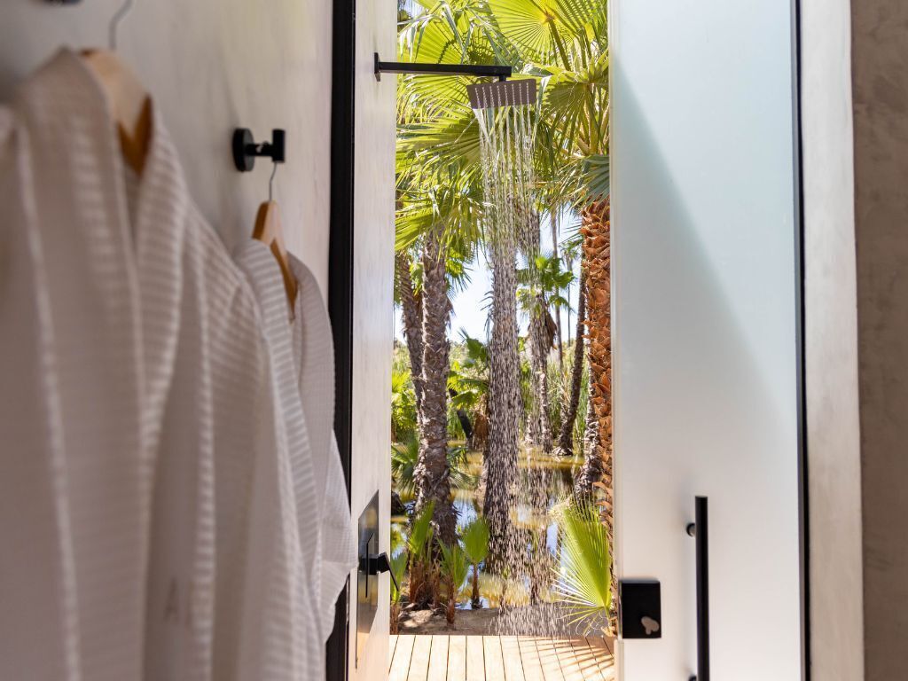 Separate tub and shower, hair dryer, slippers, towels