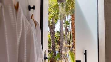 Separate tub and shower, hair dryer, slippers, towels