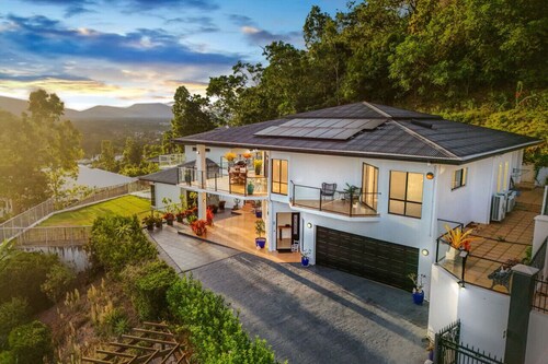 Your Ultimate Escape in Mooroobool- Luxury Tropical Retreat with Pool & Stunning Views – Perfect for Families & Groups!