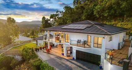 Your Ultimate Escape in Mooroobool- Luxury Tropical Retreat with Pool & Stunning Views – Perfect for Families & Groups!