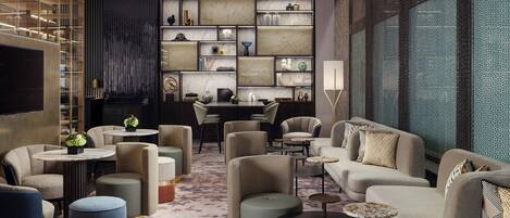 A modern lounge area with sofas, armchairs, and a coffee table, featuring a marble wall and a patterned carpet.