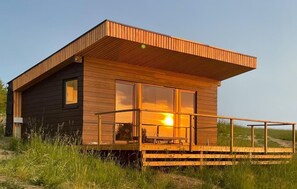 Enjoy a peaceful retreat in this cabin with a spacious deck and access to the outdoors.
