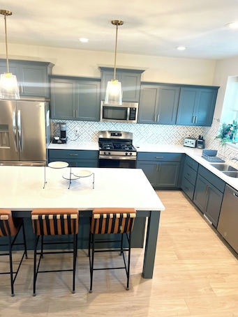 Fridge, microwave, oven, stovetop. Stunning 4-BR Townhome – Family-Friendly, Biking Trails, Pool, and Games!