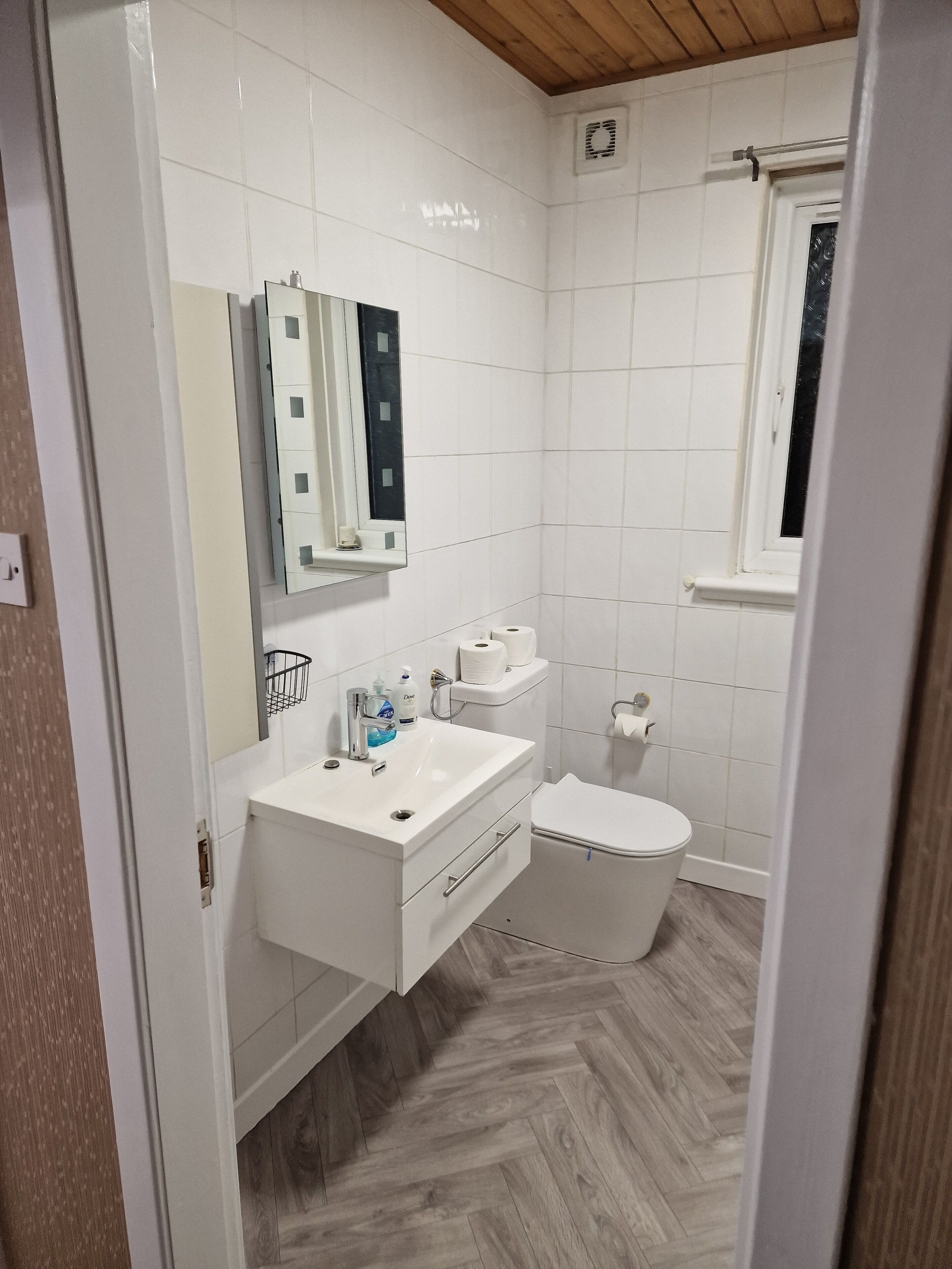 Shower, towels, soap, toilet paper