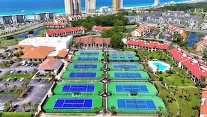A resort with multiple tennis courts, a swimming pool, and a view of the ocean. - 2BR Golf Retreat, Sleeps 8 Comfortably (Panama City Beach)