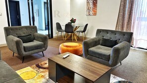 Comfort Apartment, Balcony | Living area | 40-inch LED TV with satellite channels, Netflix, streaming services - Res'Zac (Rufisque)