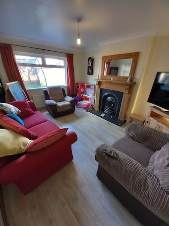 Living area. Lovely big family home with locked off street parking.