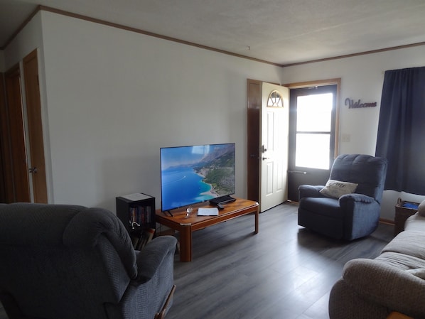 Smart TV, DVD player, foosball, books