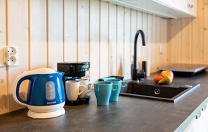 Fridge, stovetop, dishwasher, coffee/tea maker