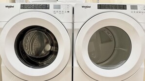 Two Whirlpool front-loading washing machines side by side. - Disneyland Getaway Tri-level Gated Townhome (Placentia)