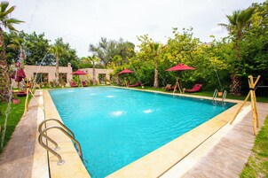 Outdoor pool, pool umbrellas, sun loungers