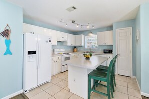 Fridge, microwave, oven, stovetop - "Mermaid Cove" offers canal views, fenced-in yard, boat parking, pet friendly! (Mexico Beach)
