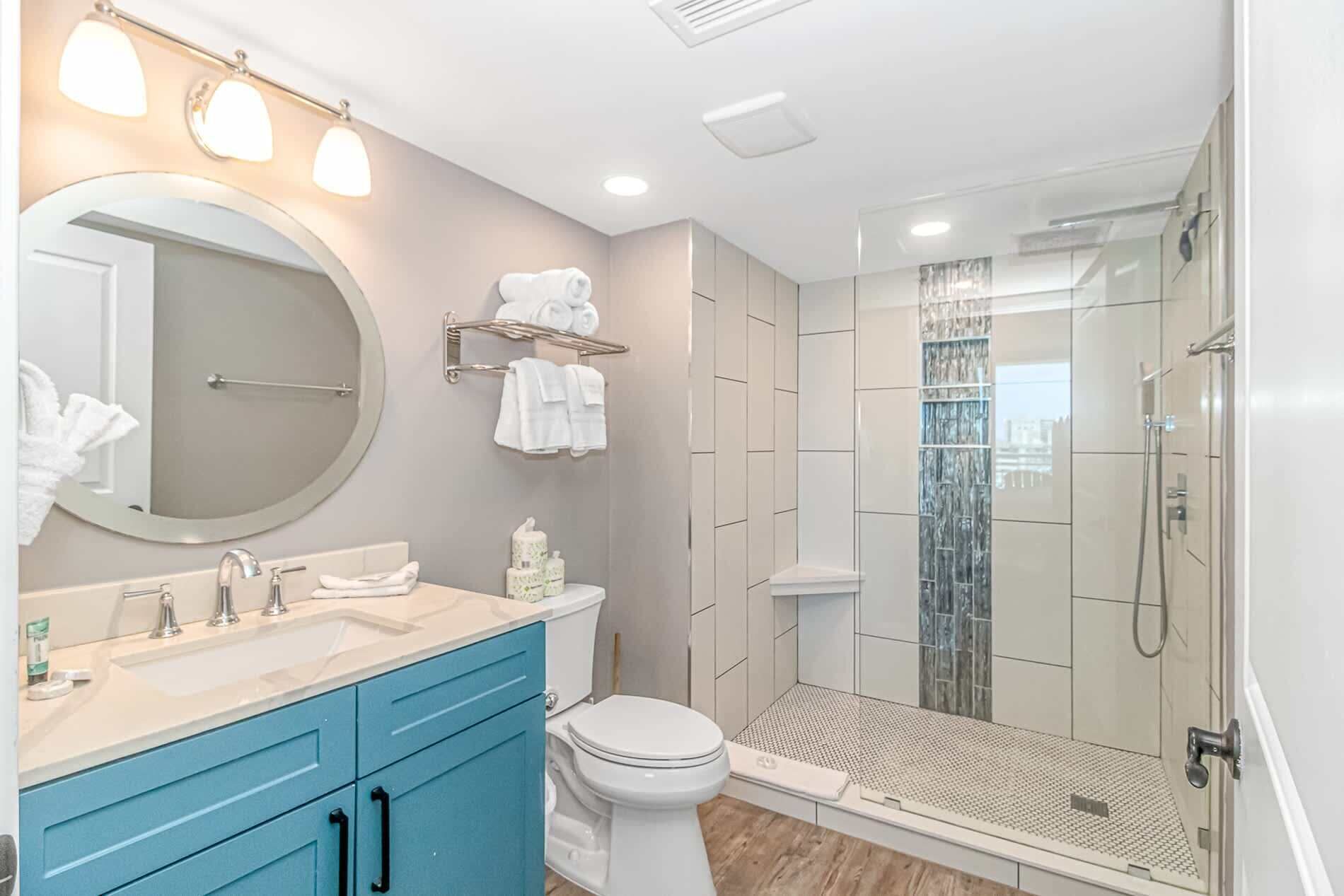 Shower, hair dryer, towels, shampoo