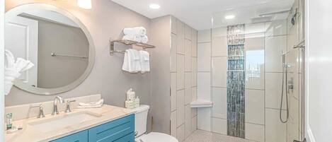Shower, hair dryer, towels, shampoo