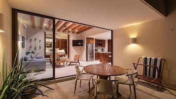 A modern interior with a dining area, kitchen, and living space.
