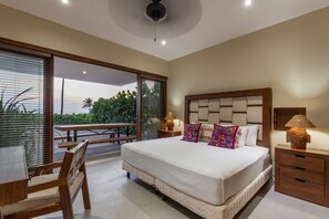 A bedroom with a large bed, bedside tables, a desk, and a view through the window. - 3BR Villa I Breathtaking Ocean Views + Terrace (Zihuatanejo)