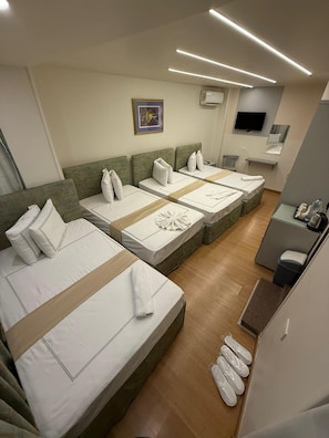 Deluxe Quadruple Room | 1 bedroom, Egyptian cotton sheets, premium bedding, in-room safe