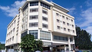 A multi-story hotel with a modern design, featuring large windows and a flat roof. - EAST VIEW HOTEL (Bacolod)