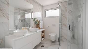 Shower, hair dryer, towels, soap