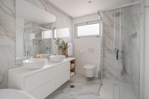 Shower, hair dryer, towels, soap