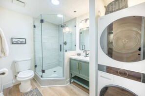 Shower, hair dryer, towels, shampoo