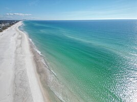 On the beach, white sand, beach towels, 5 beach bars