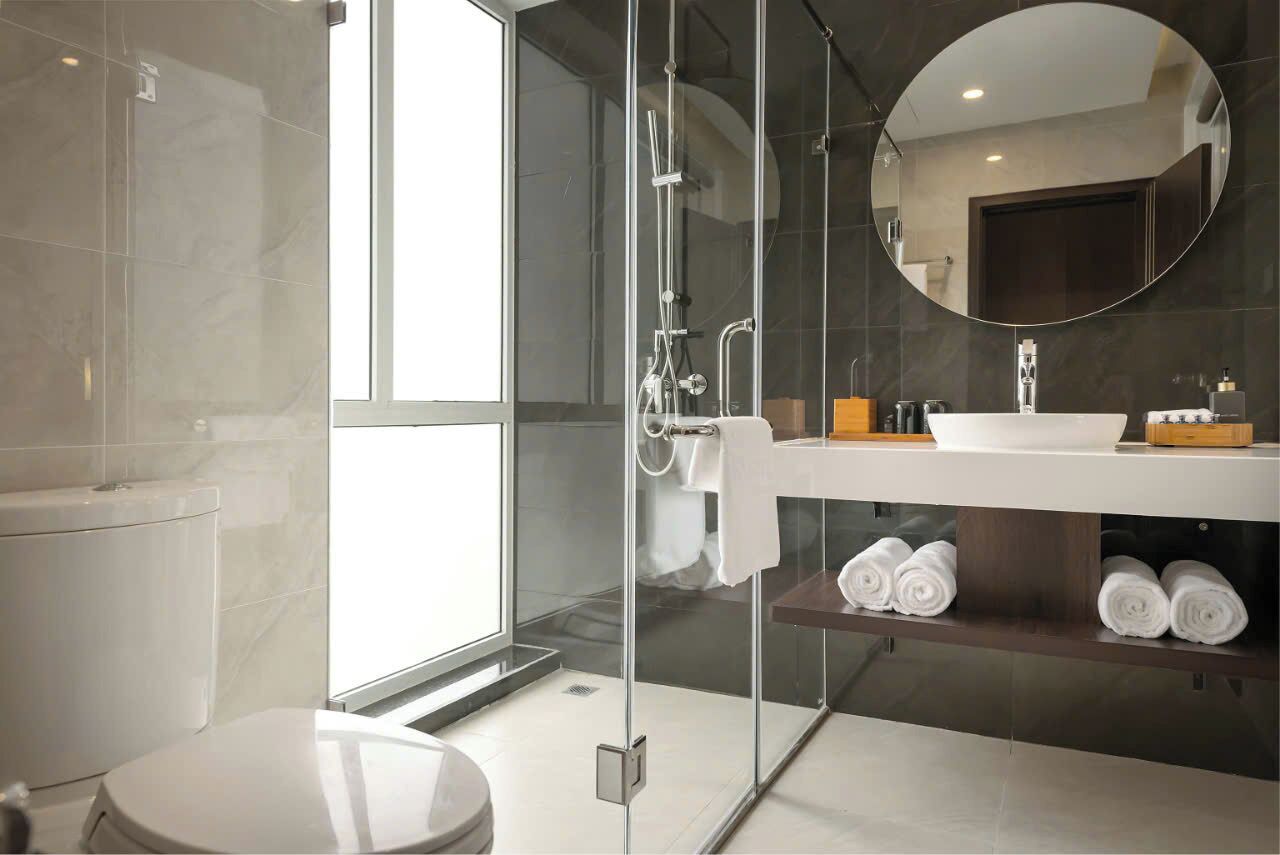 Combined shower/bathtub, designer toiletries, hair dryer, bathrobes