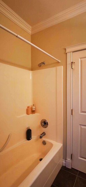 Enjoy a refreshing soak in the bathtub, shower, and relax with a towel nearby.