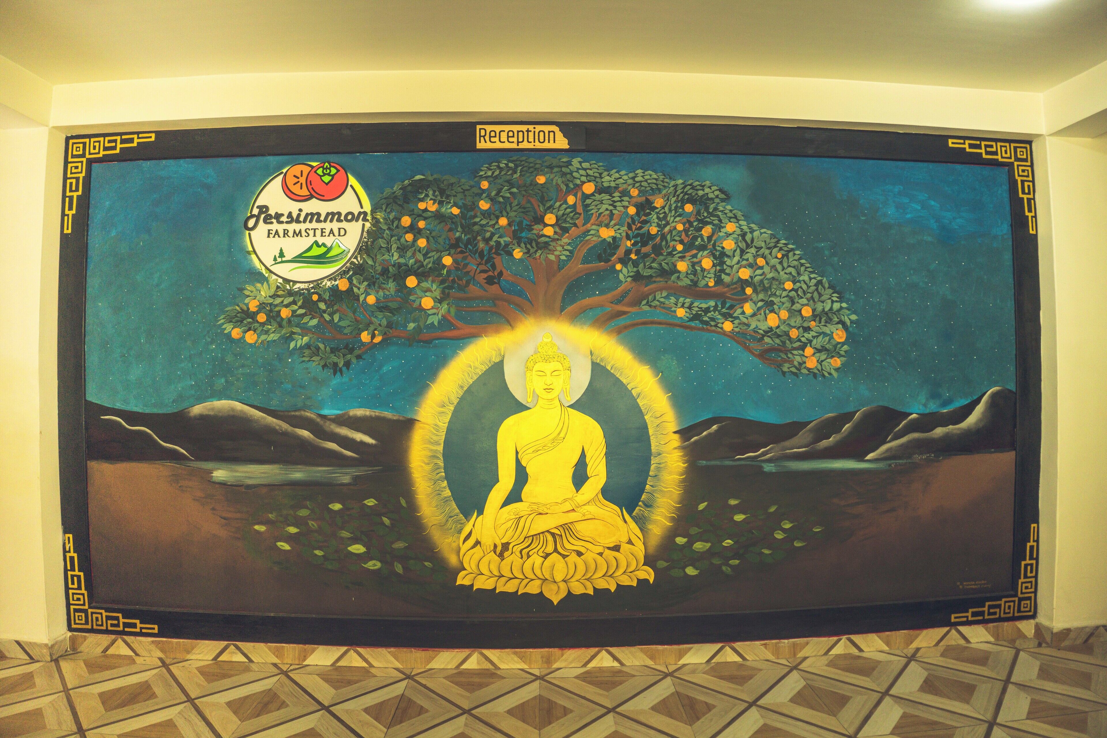 A mural with a seated figure in a meditative pose, surrounded by a tree with fruit, and a label reading "Reception".