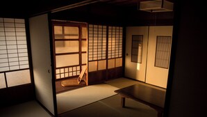 Ein traditioneller japanischer Raum mit Tatami-Böden, Schiebetüren und einem niedrigen Holztisch.