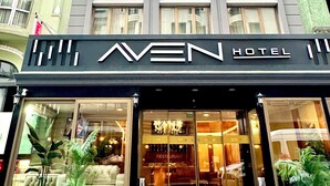 A hotel with a modern facade, large windows, and a prominent 'AVEN HOTEL' sign. - Aven Hotel (Istanbul)