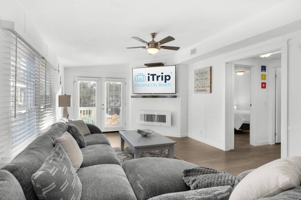 The cozy living area offers a large screen tv and electric fireplace