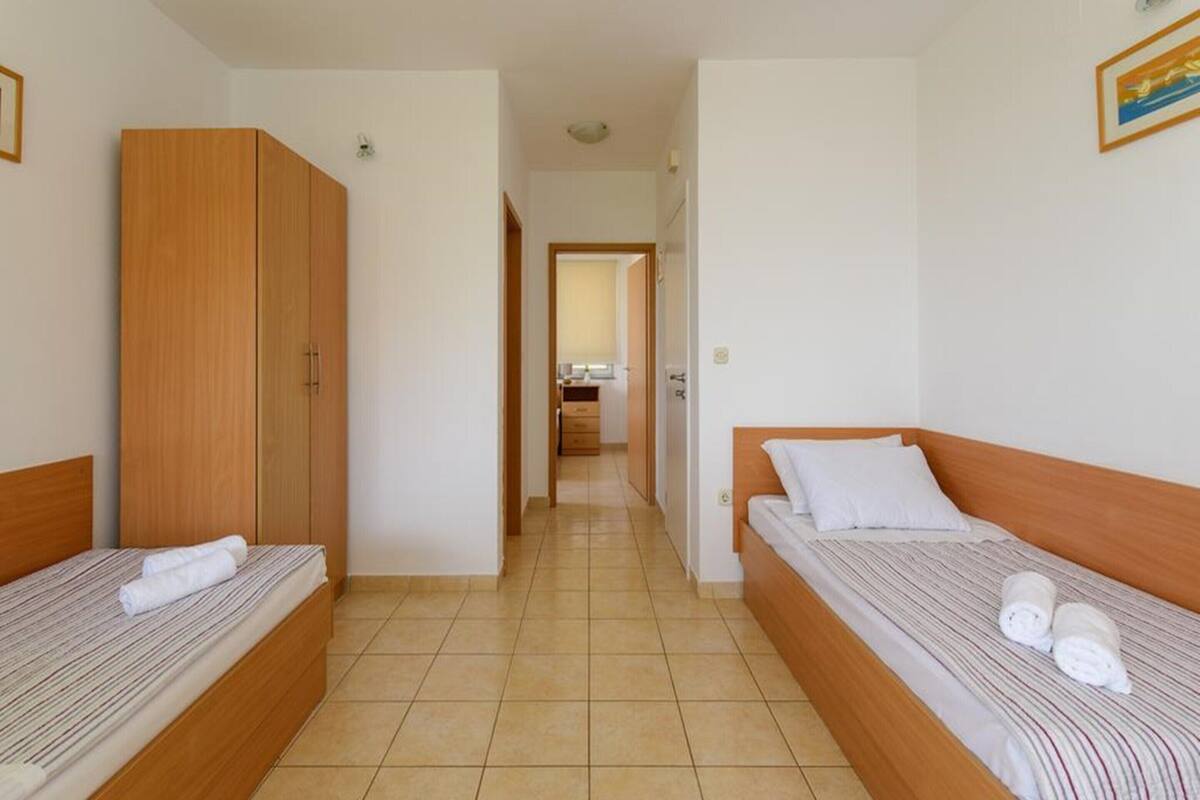 Apartemen Comfort, 2 kamar tidur | 4 kamar tidur dan seprai linen