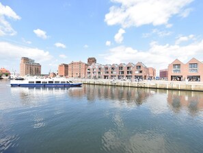 Waterfront buildings with a marina and boat dock.
