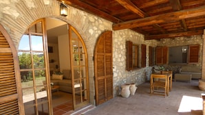 A rustic stone building with wooden doors and shutters, a brick floor, and a wooden ceiling. - SCAPPO IN UMBRIA, Casale Fasulo (Umbria)