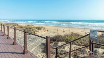 On the beach, sun loungers, beach towels