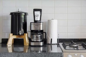 Fridge, microwave, stovetop, coffee/tea maker