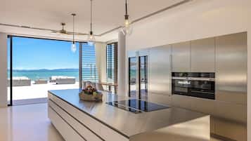 Fridge, microwave, coffee/tea maker, cookware/dishes/utensils