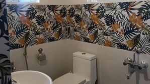 A bathroom with a toilet, bidet, and sink. - Abhishta Agri Farm Stay (Kunigal)
