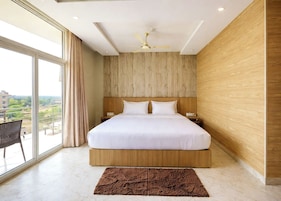 Premium bedding, desk, laptop workspace, soundproofing