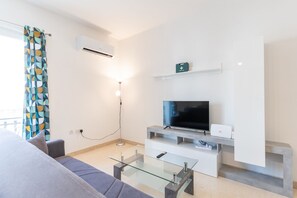 Deluxe-huoneisto, 3 makuuhuonetta, keittiö, kaupunkinäköala | Oleskelualue