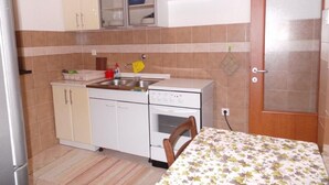 Private kitchen | Fridge, electric kettle - Cosy Apartment in Kraljevica With Balcony (Kraljevica)