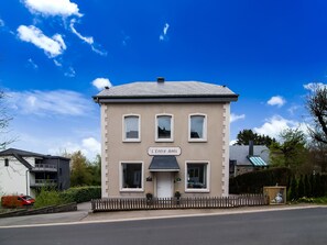 A two-story building with a sign reading 'L'Ente Amis' at the entrance. - Spacious Mansion in Waimes With Sauna (Waimes)