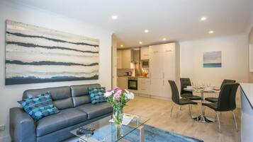 Deluxe Apartment, 2 Bedrooms, Non Smoking, Kitchen | Living area | Flat-screen TV