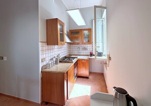 Departamento, balcón, vista a la ciudad | Cocina privada