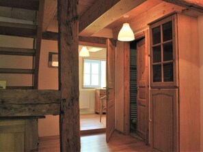 Staircase leads to a room with a large window.