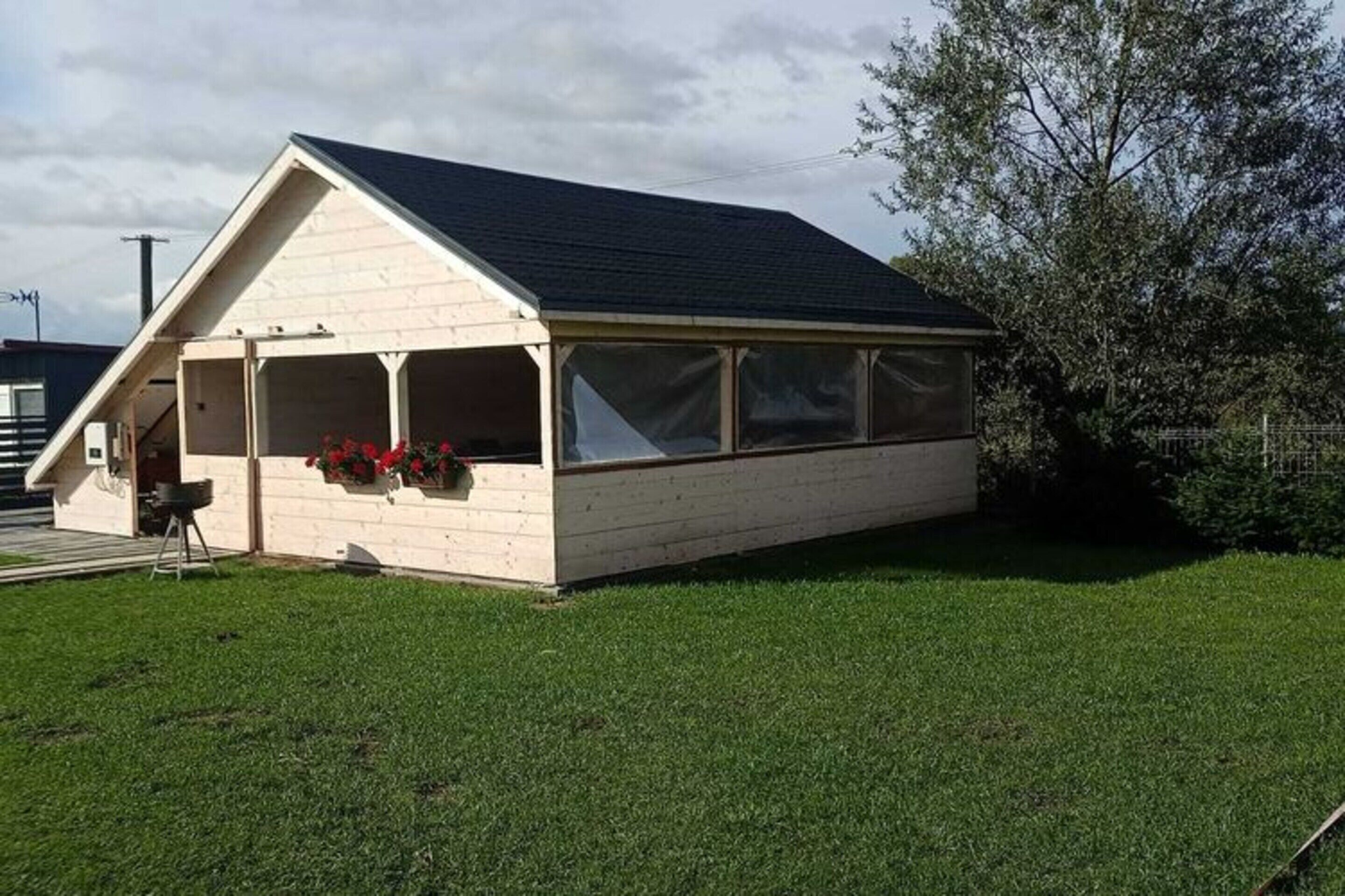 A single-story house with a gabled roof and a covered porch.