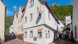 A traditional European building with a sign indicating it is a restaurant. - Cosy Holiday Home in Sankt Goarshausen With Barbecue (Sankt Goarshausen)