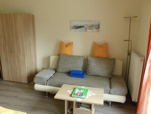 Apartamento conforto, 2 quartos | Sala de estar
