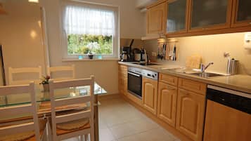 Comfort Apartment, 2 Bedrooms | Private kitchen | Fridge, microwave, oven, dishwasher